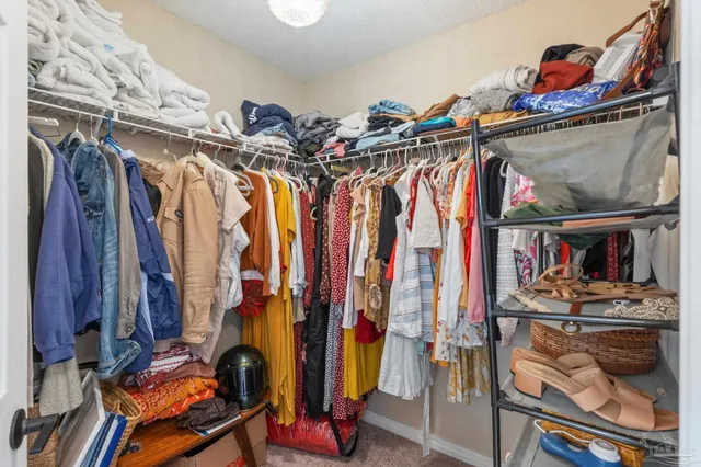a view of a backyard with wooden fence