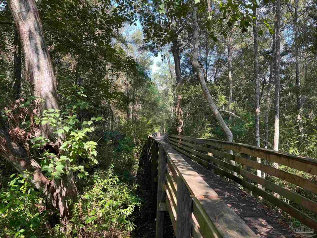 a view of a room and wooden floor