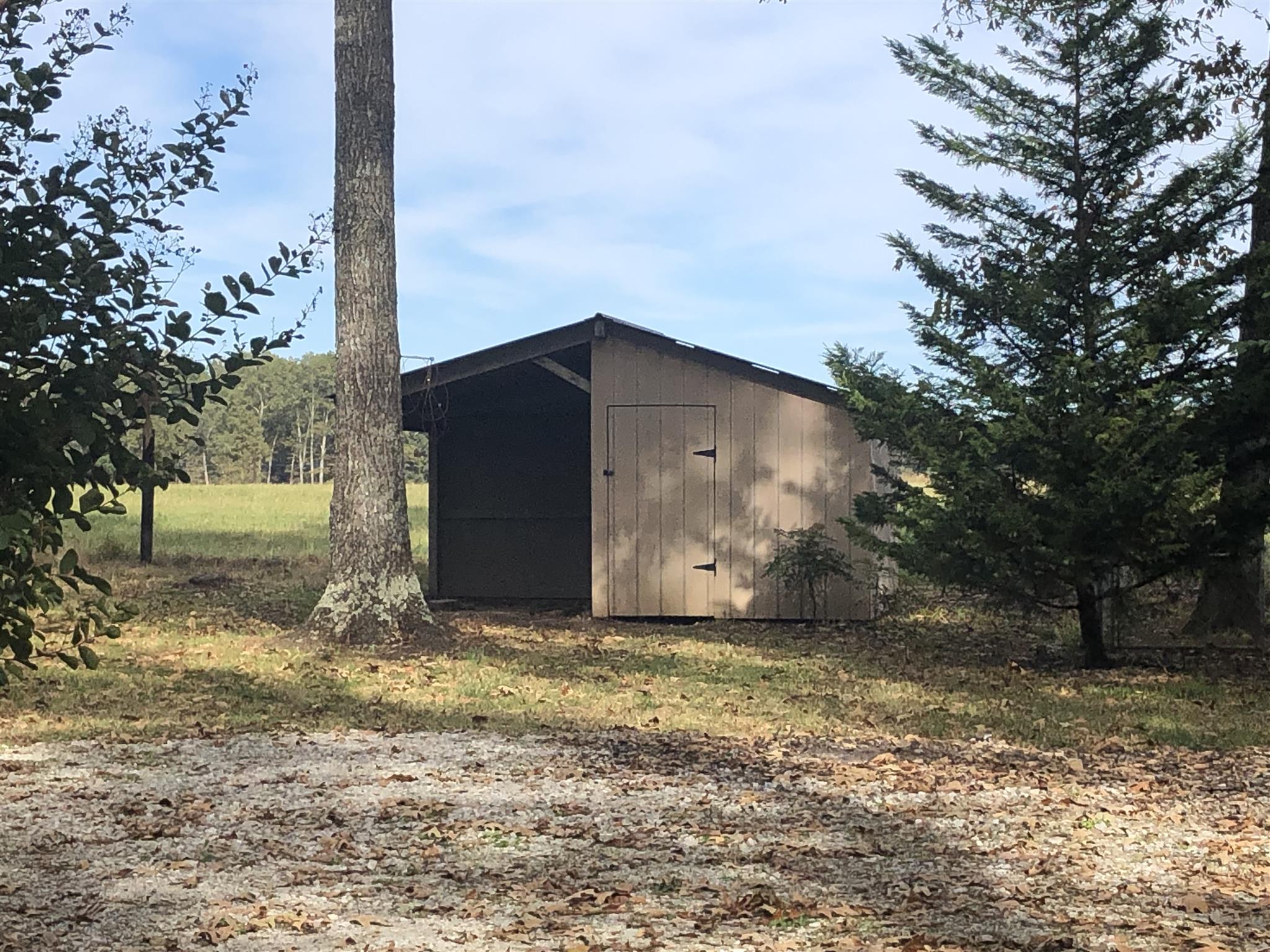246 Leslie Jamie Road Manchester, TN 37355 - Photo 21 of 23 Little Storage building and area to keep your firewood dry!