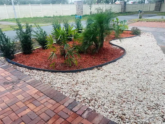 a view of a backyard of the house