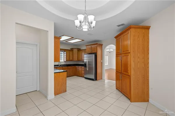 a view of a kitchen with a refrigerator