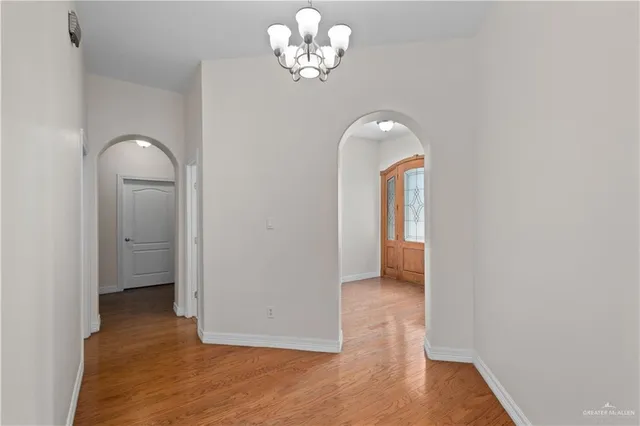 a view of a room with wooden floor