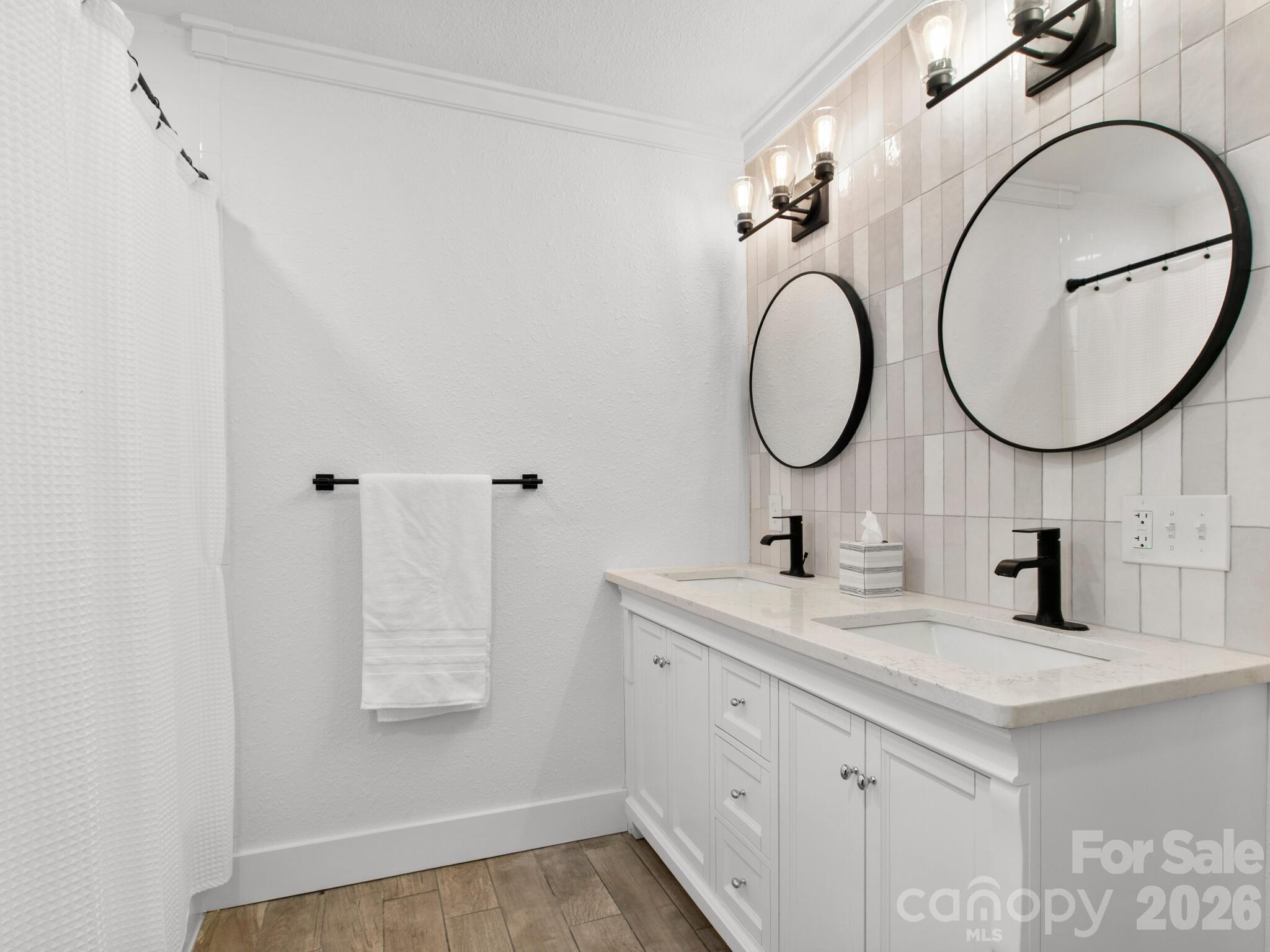 10 Bear Trail Fairview, NC 28730 - Photo 21 of 29 a bathroom with a sink and a mirror