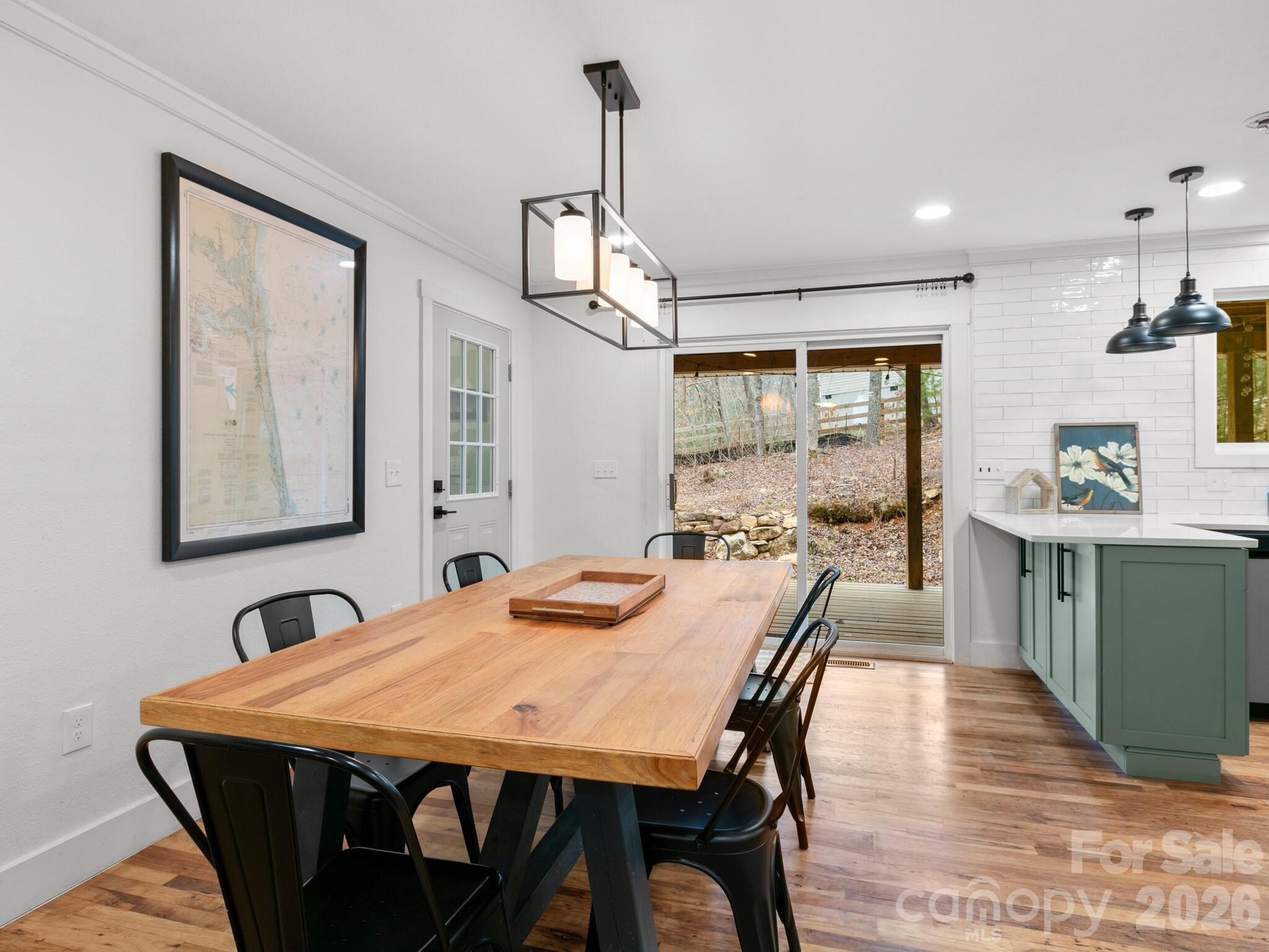 10 Bear Trail Fairview, NC 28730 - Photo 4 of 29 a dining room with a wooden table and chairs