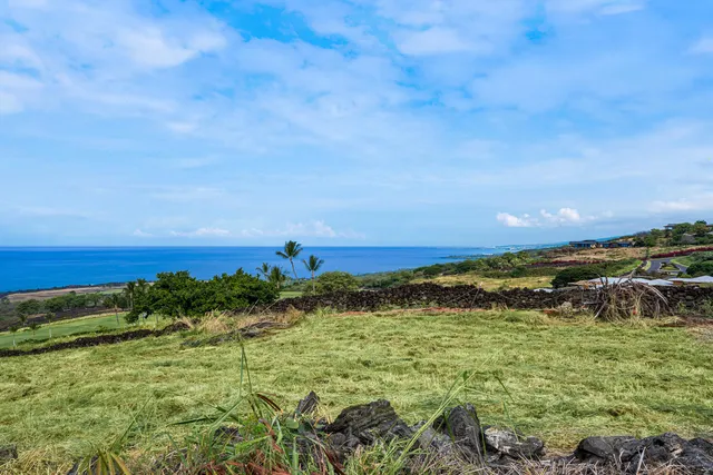 a view of an ocean beach and mountain