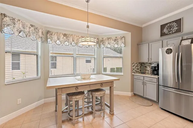 a kitchen with stainless steel appliances granite countertop a stove and a refrigerator