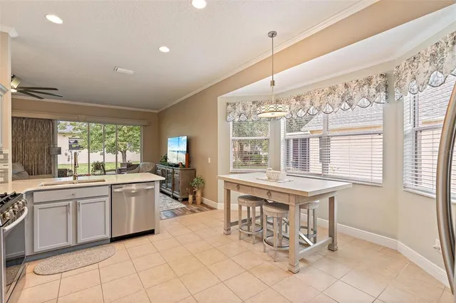 a kitchen with granite countertop a sink and appliances