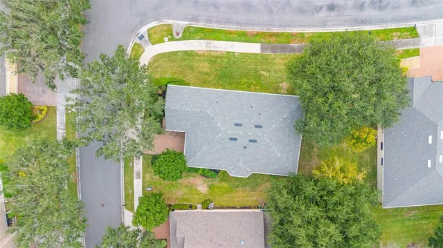 an aerial view of a house with a garden