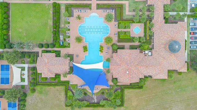 an aerial view of a house with garden space and street view