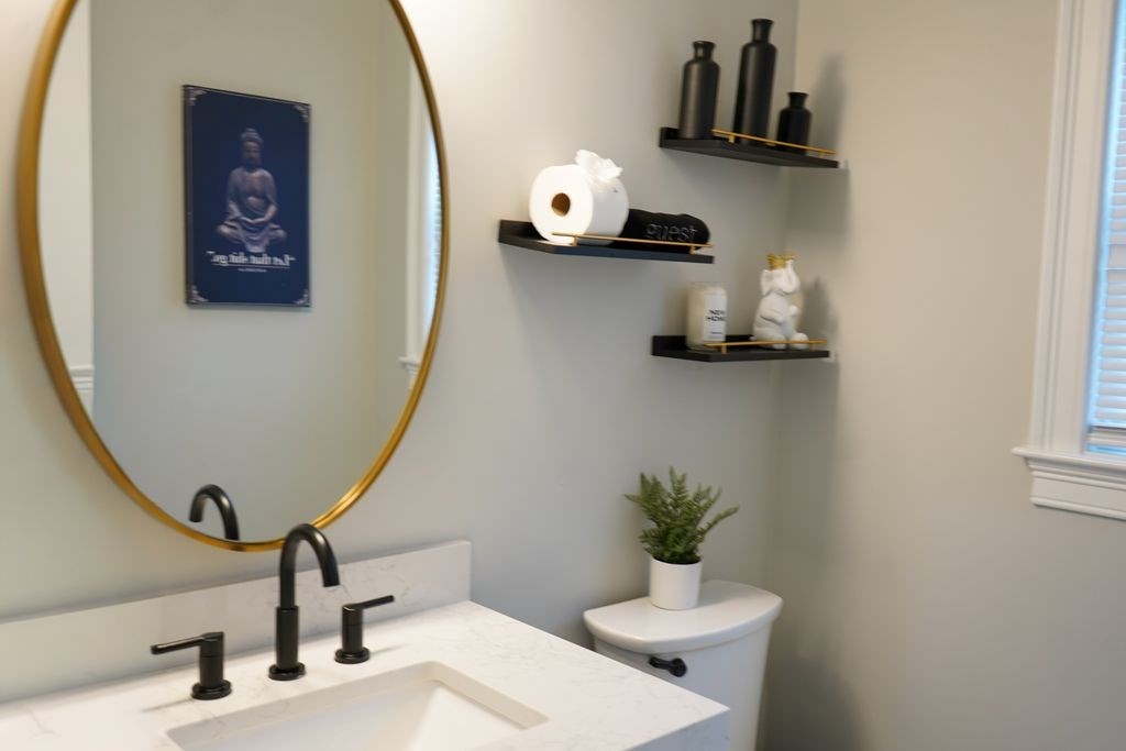 242 Valley Road Needham, MA 02492 - Photo 11 of 24 a bathroom with a sink and a mirror