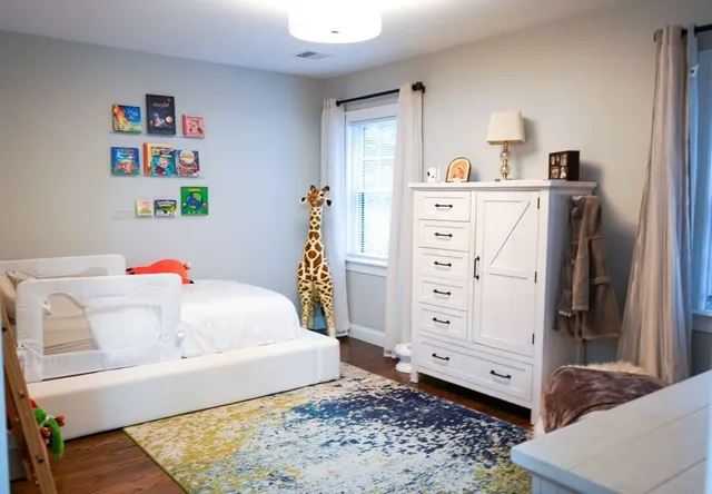 a bedroom with a bed and a cabinets