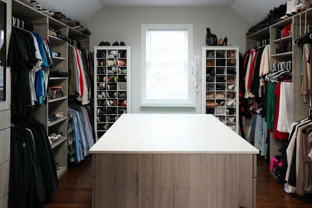 242 Valley Road Needham, MA 02492 - Photo 16 of 24 a view of walk in closet with clothes and shoes