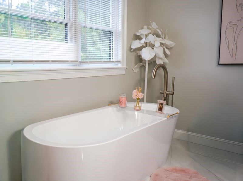 242 Valley Road Needham, MA 02492 - Photo 18 of 24 a white bath tub sitting next to a white sink