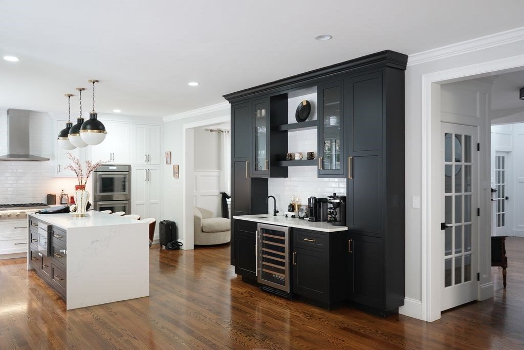 242 Valley Road Needham, MA 02492 - Photo 3 of 24 a kitchen with stainless steel appliances a sink stove and wooden floor