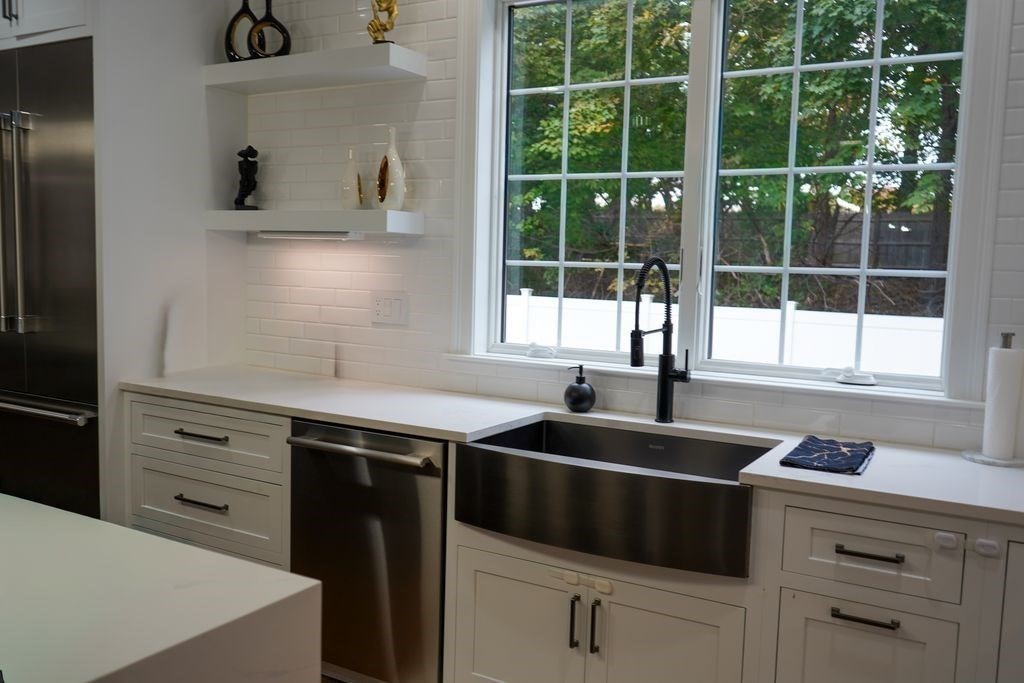 242 Valley Road Needham, MA 02492 - Photo 4 of 24 a kitchen with appliances cabinets and a sink