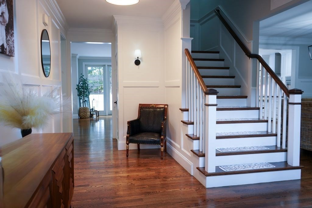 242 Valley Road Needham, MA 02492 - Photo 7 of 24 a view of entryway and hall with wooden floor