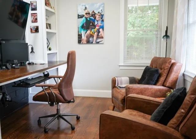 a work room with furniture and a window