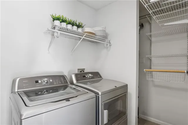 a view of storage and utility room with washer and dryer