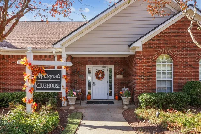 a front view of a building with garden