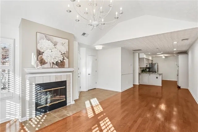 a view of an empty room with a fireplace
