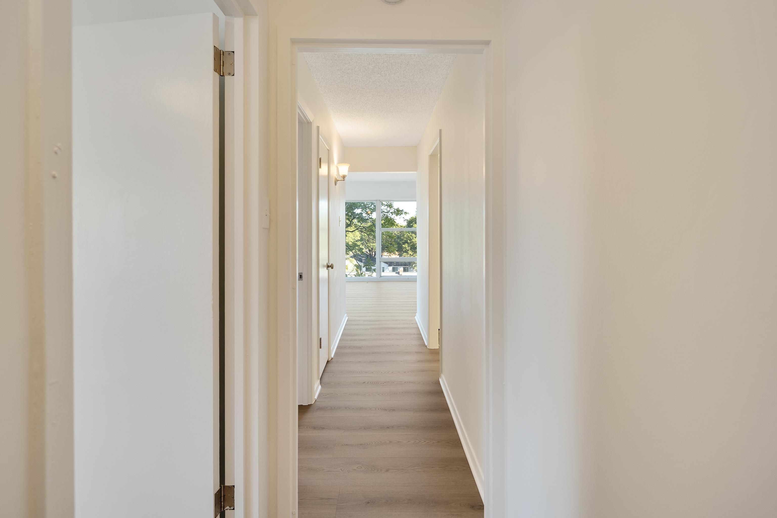 232 South Highland Street, Unit 601 Memphis, TN 38111 - Photo 22 of 37 a view of a hallway with wooden floor and closet