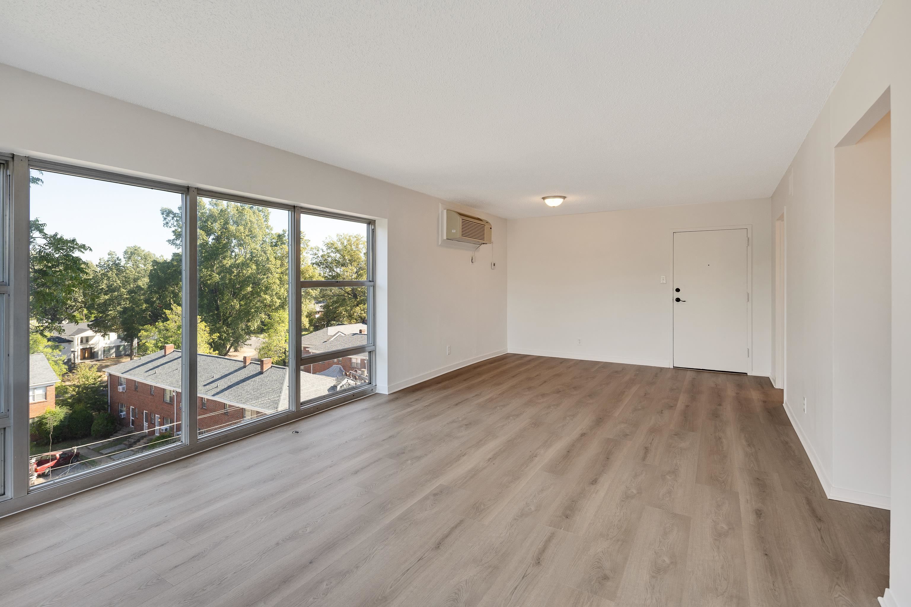232 South Highland Street, Unit 601 Memphis, TN 38111 - Photo 8 of 37 an empty room with wooden floor and windows