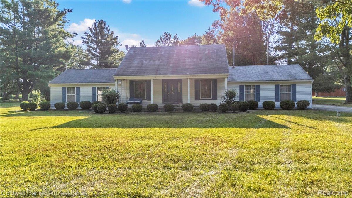 980 West Predmore Road Oakland, MI 48363 - Photo 1 of 11 Ranch-style residence featuring a white exterior with blue shutters