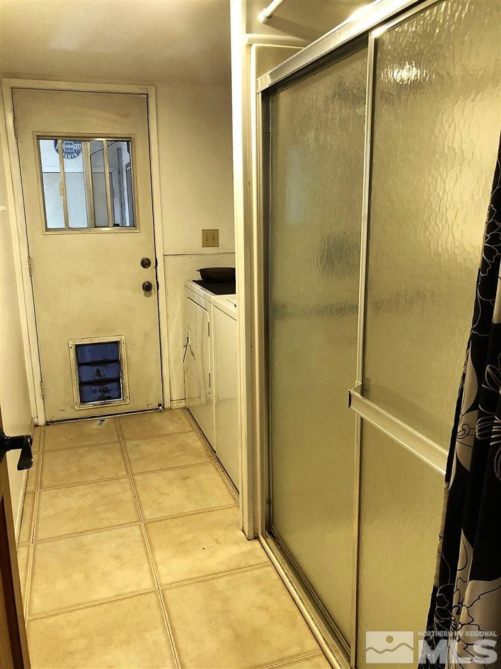 2180 Figoni Ranch Road, Unit NV Sparks, NV 89434 - Photo 17 of 39 a bathroom with a glass door shower
