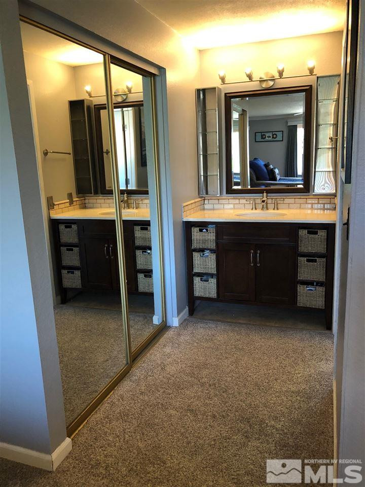 2180 Figoni Ranch Road, Unit NV Sparks, NV 89434 - Photo 20 of 39 a bathroom with a sink vanity and mirror