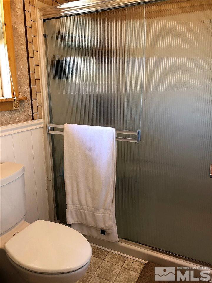 2180 Figoni Ranch Road, Unit NV Sparks, NV 89434 - Photo 21 of 39 a bathroom with a toilet and a shower