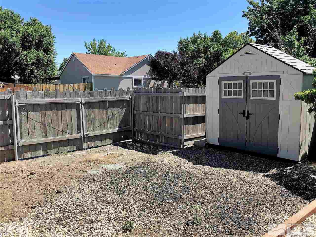 2180 Figoni Ranch Road, Unit NV Sparks, NV 89434 - Photo 30 of 39 a view of a house with wooden fence