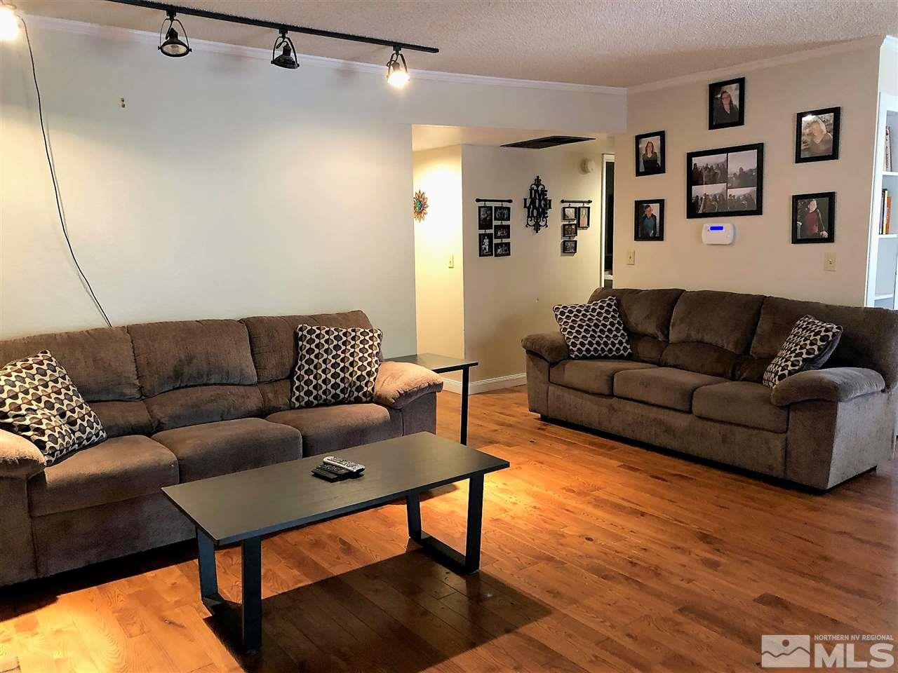 2180 Figoni Ranch Road, Unit NV Sparks, NV 89434 - Photo 8 of 39 a living room with furniture and a wooden floor