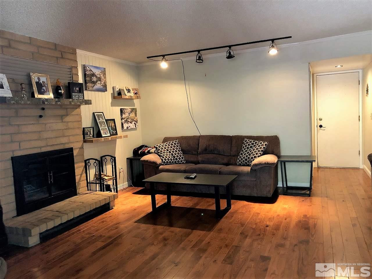 2180 Figoni Ranch Road, Unit NV Sparks, NV 89434 - Photo 9 of 39 a living room with furniture and a fireplace