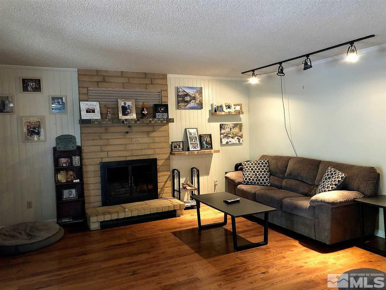 2180 Figoni Ranch Road, Unit NV Sparks, NV 89434 - Photo 10 of 39 a living room with furniture and a fireplace