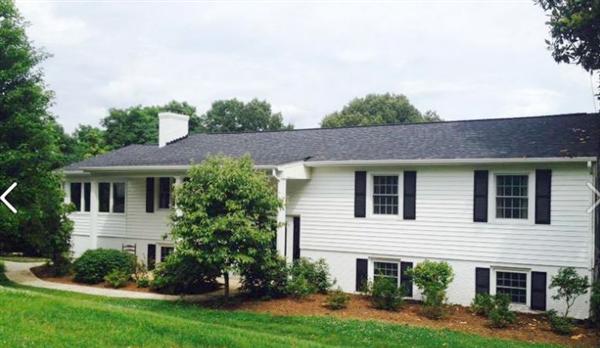 4536 Rosecrest Road Roanoke, VA 24018 - Photo 2 of 24 a front view of a house with a yard and trees