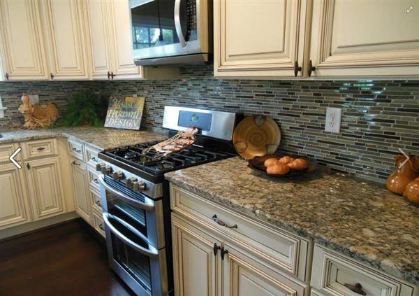 4536 Rosecrest Road Roanoke, VA 24018 - Photo 12 of 24 a kitchen with stainless steel appliances granite countertop a stove and a microwave