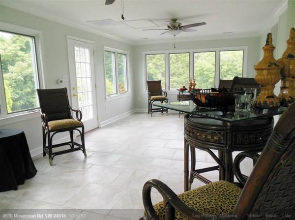 4536 Rosecrest Road Roanoke, VA 24018 - Photo 14 of 24 a living room with furniture and a floor to ceiling window