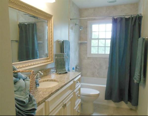 4536 Rosecrest Road Roanoke, VA 24018 - Photo 19 of 24 a bathroom with a granite countertop sink toilet and shower