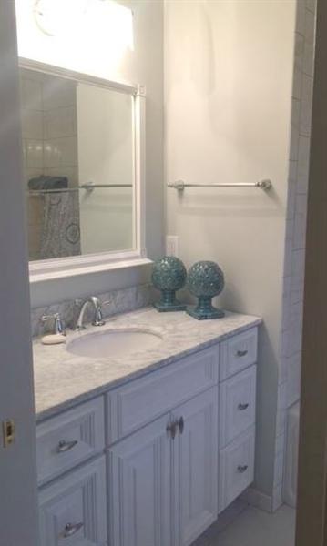 4536 Rosecrest Road Roanoke, VA 24018 - Photo 20 of 24 a bathroom with a granite countertop sink and a mirror