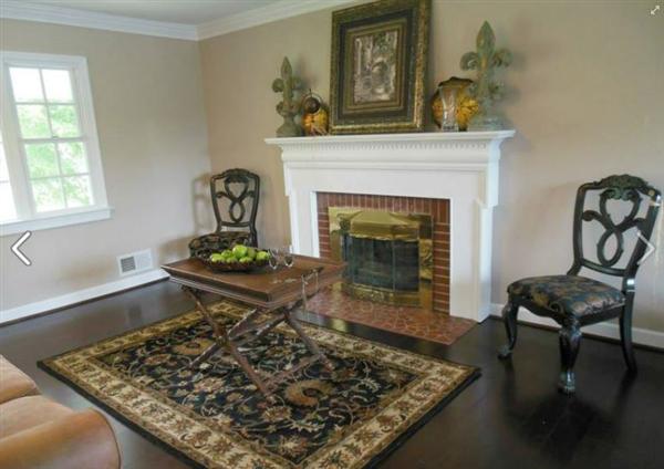 4536 Rosecrest Road Roanoke, VA 24018 - Photo 6 of 24 a living room with a couch a rug and a fireplace