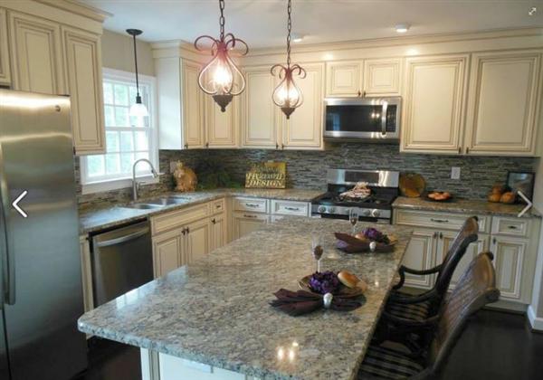 4536 Rosecrest Road Roanoke, VA 24018 - Photo 9 of 24 a kitchen with stainless steel appliances granite countertop a sink a stove and a wooden floors