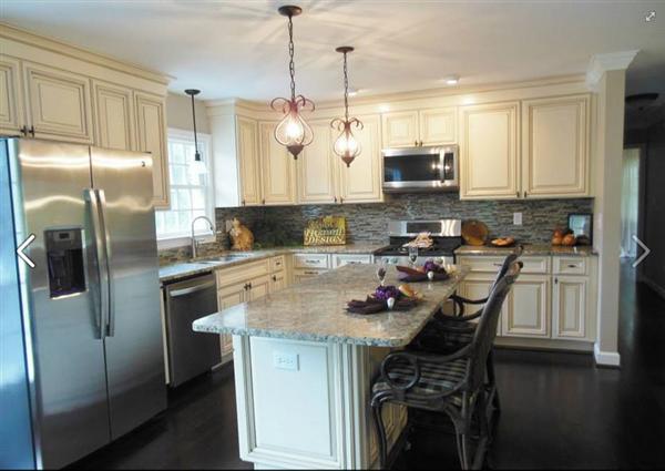 4536 Rosecrest Road Roanoke, VA 24018 - Photo 10 of 24 a kitchen with kitchen island a counter space a sink appliances and cabinets