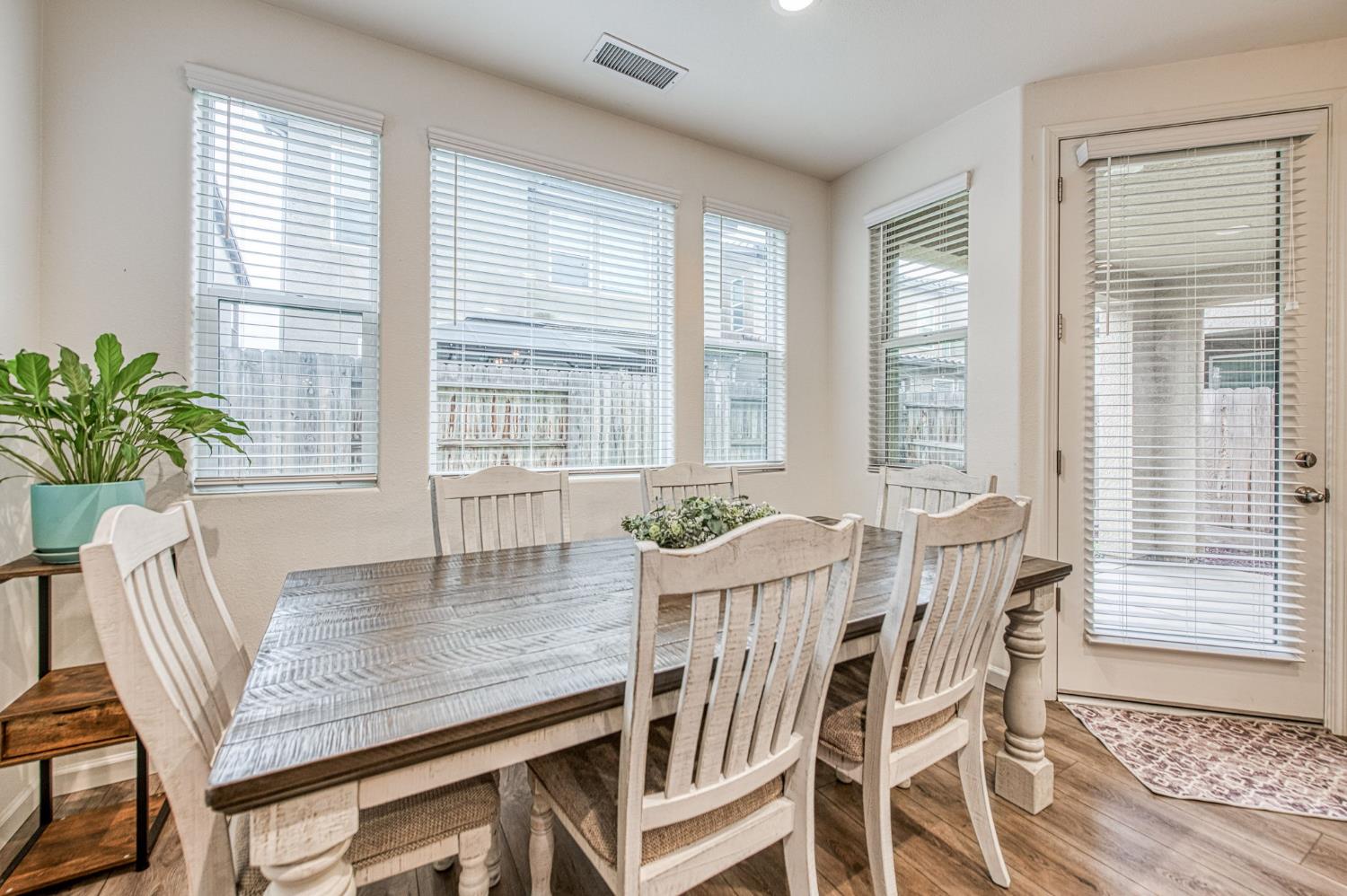 123 Capstone Way South Madera, CA 93636 - Photo 12 of 32 a view of a dining room with furniture and window