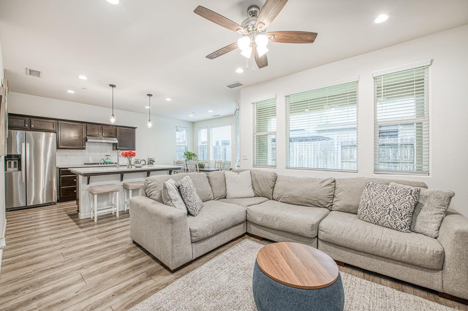 123 Capstone Way South Madera, CA 93636 - Photo 5 of 32 a living room with furniture kitchen and a large window