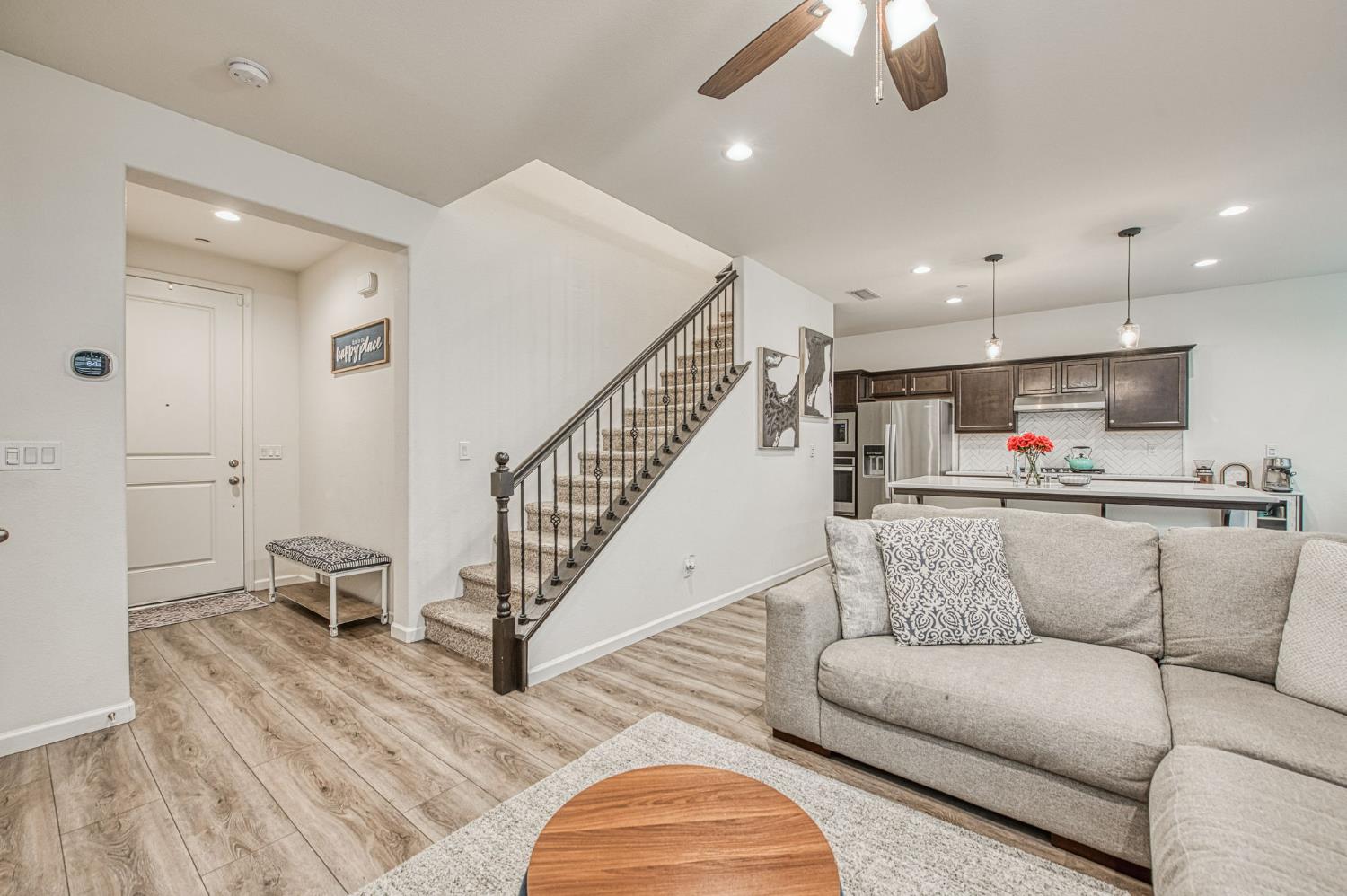 123 Capstone Way South Madera, CA 93636 - Photo 6 of 32 a living room with furniture and kitchen view