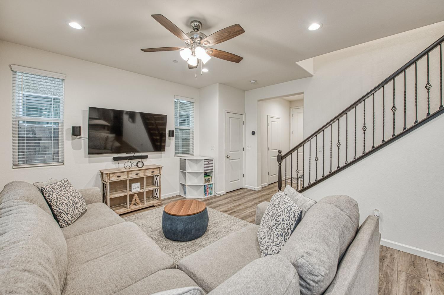 123 Capstone Way South Madera, CA 93636 - Photo 7 of 32 a living room with furniture and a flat screen tv