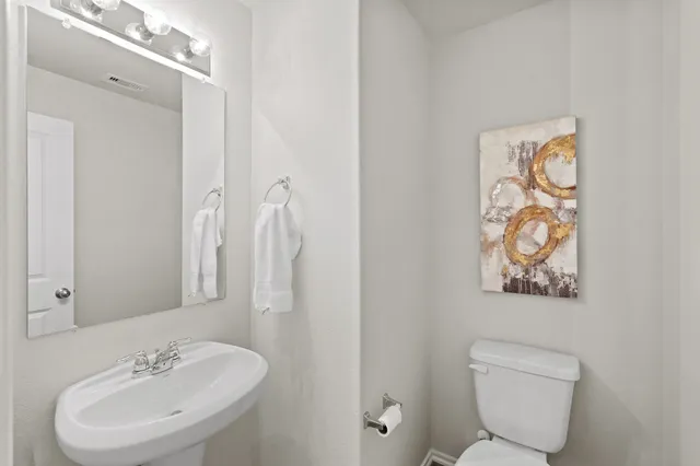 a bathroom with a sink vanity and a mirror