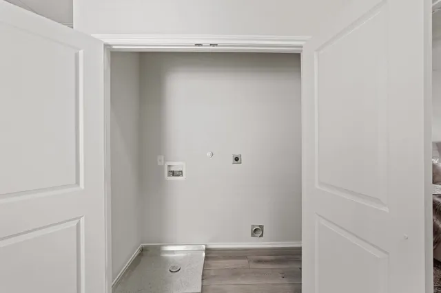a bathroom with a double vanity sink toilet and shower