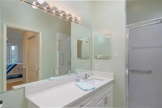 a bathroom with a sink and a mirror