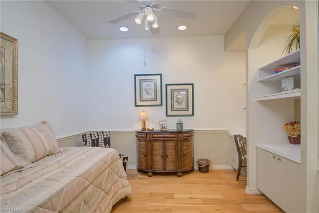 a bedroom with a bed and cabinets